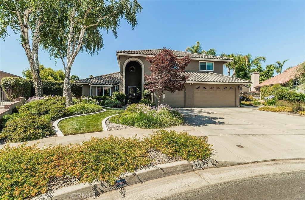 Owned Solar! This immaculate, beautifully maintained, pride of ownership 4 bedrooms and 3 bathrooms home is in one of the most desirable neighborhoods in the community on a lovely, quiet cul de sac lot. Enjoy the well designed floor plan with a lovely mirrored entryway, separate living room with a bay window, dining room with french doors leading to the rear yard, and spacious family room with a gas fireplace next to an additional eating area. The well designed and updated kitchen has a breakfast bar, large pantry, granite countertops with accented tiled backsplash, and lovely white cabinets. Special features in the home include new windows, desirable custom window treatments, tiled floors, laminate like wood flooring, coffered ceilings, loads of crown molding, and tons of storage throughout including another walk-in pantry near the laundry room. The primary bedroom is very large with a view to the backyard and very relaxing main bathroom with a walk in closet. The conveniently located additional 3 bedrooms are all good size near the hall bathroom with a shower and a tub. You and your family and guests will not want to leave this amazing backyard with a relaxing swimming pool, multiple sitting areas, patios, pergola, raised garden area, special curbing around grass areas, newer fencing, citrus trees, and a fabulous TuffShed with workbench and electricity for all your needs, The three car garage includes builtin cabinets and finished flooring too for all your vehicle and storage needs.