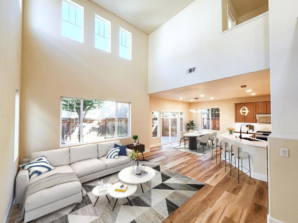 Stunning 3-Bedroom Home in Desirable Alder Creek Circle! Step inside this beautifully updated 3-bedroom, 2.5-bath home complete with a convenient first-floor powder room and be welcomed by a dramatic vaulted-ceiling living room filled with natural light. Fresh interior paint and modern vinyl flooring create a warm, contemporary feel from the moment you enter. The open-concept dining area flows into the chefs kitchen, showcasing a stylish peninsula with quartz countertops, oversized stainless steel sink, premium LG Studio gas range and dishwasher, state-of-the-art Slant Vent range hood, oversized pantry, and a sleek LED pendant light. A modern LED chandelier adds sophistication to the dining space. Upstairs, the spacious primary suite boasts a generous walk-in closet, spa-inspired bath, and relaxing rain shower perfect for unwinding. A Jack-and-Jill bath connects the secondary and the third bedrooms. The laundry room with washer and dryer adds convenience. The side-by-side two-car garage includes wall shelving on both sides for extra storage. Enjoy excellent access to major freeways and the S.L. BART station, plus shopping at Costco, nearby retail centers, and the lively downtown filled with shops and restaurants. Images contain virtual staging for illustrative purposes only.