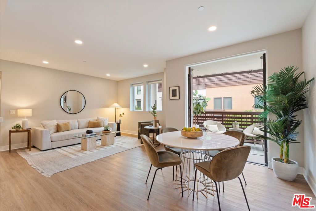 Welcome to refined living in the heart of Playa Vista. Perched on the 4th floor of The Seabluff, this stylish 3-bedroom, 2-bath corner residence offers the ideal balance of modern design, comfort, and natural light. Spanning approximately 1,280 square feet of thoughtfully planned single-level living, this east-facing home captures serene views of the Westchester bluffs and lush courtyard below. The open-concept layout flows seamlessly from the sleek, modern kitchen, complete with stainless steel appliances, designer finishes, and warm neutral tones, into a bright and inviting living space. Window shades on all windows provide both privacy and light control. Step out to your private covered balcony and enjoy peaceful mornings or golden-hour evenings with tranquil, peek-a-boo bluff views. The expansive primary suite features a spa-inspired bath, a fully built-out California Closet, and a calming retreat for unwinding. Two generous guest bedrooms share a full bath and offer flexible options for a home office, guests, or creative pursuits. Additional conveniences include in-unit laundry, two side-by-side subterranean parking spaces, EV charging throughout the garage, and a large private 100 sq. ft. storage unit. The HOA also includes 1 gigabyte fiber internet and cable TV. The Seabluff is a boutique, newer-construction community featuring beautifully landscaped courtyards, a cozy outdoor fireplace, and peaceful water features. Step outside and you're moments from Concert Park, local cafes, The Coffee Bean, Yummy Market, and all the dining, shopping, fitness, and entertainment the Runway has to offer. Experience the best of Southern California living where luxury, location, and lifestyle meet in one of Playa Vista's most sought-after communities.