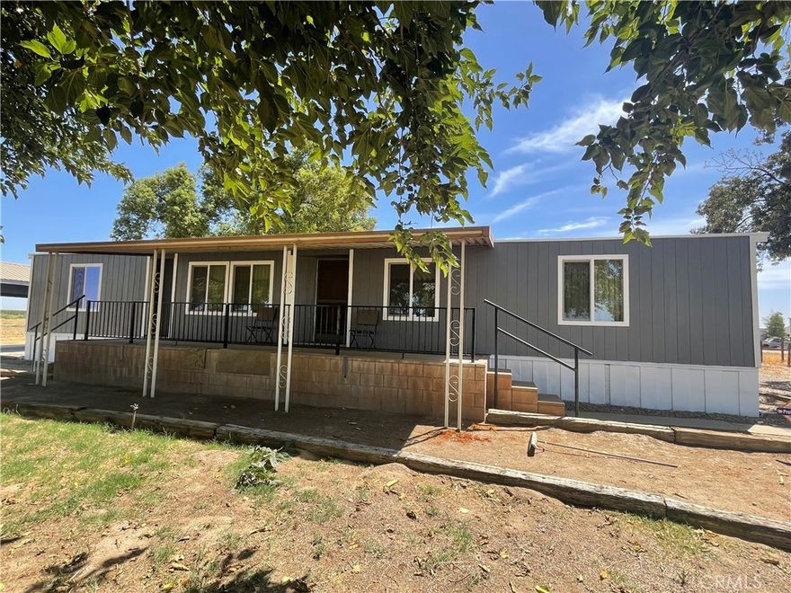 Rare opportunity for peaceful country living on 2.5 acres. Mobile Home has 3 bedrooms 2 bathrooms, living and formal dining room with built in cabinets. Outside you'll find the shop with an attached covered carport and shed. Looking for horse property? This home already has a horse corral. Plenty of space to create your dream home, the ideas are endless.  Relax outside on the covered patio, enjoying the beautifully landscaped property.