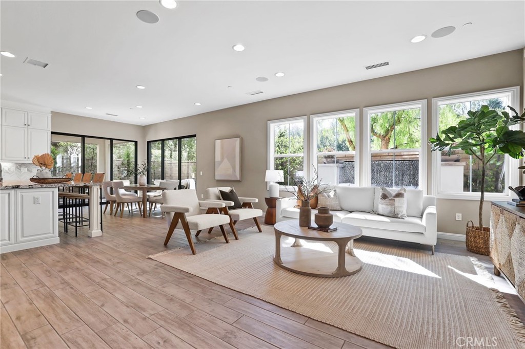 Located in the Prestigious Resort Style Community of Baker Ranch, this Stunning 4 Bedroom Turn-Key Residence is Fully Upgraded and Impeccably Designed for the Modern Buyer. Offering FULLY PAID SOLAR this Model Quality home will have you in awe from the moment you step through the front door. Gorgeous Neutral Toned Tile Floors, Soaring Two-Story Ceilings and a Light & Bright Interior bathed in Natural Light. Continue into the Open Concept Great Room featuring Built In Speakers, Custom Paint, Spacious Dining Area and Two Massive Stacking Doors Creating Quintessential California Indoor/Outdoor Living. The Incredible Chef’s Kitchen has it all featuring Beautiful Upgraded White Cabinets, Stainless Steel Appliances w/Built-In Refrigerator, Gas Stove, Water Filtration, Mosaic Artisanal Tile Back Splash, Quartz Countertops, Spacious Walk-In Pantry and Large Center Island w/Bar Seating. The highly desirable Downstairs Bedroom w/Full Bathroom provides incredible flexibility and convenience. Upstairs you will find the Spacious Laundry Room, 3 Additional Bedrooms and the Charming Multi-Purpose Loft w/ 2 Built In Tech Desks. Unwind & Relax in the Tranquil Spacious Primary Suite Retreat featuring an Abundance of Natural Light leaving you well rested and calm. Ease Yourself into a New Wellness Routine in your Spa-Like Primary Bathroom featuring Dual Vanities, Quartz Countertops, Restorative Glass Walk-In Shower w/ Custom Designer Tile Accents, Large Soaking Tub, Neutral Tile Flooring and a Massive Walk-In Closet w/ Custom Closet Organizers. The outdoor space is accessed through those incredible 2 Custom Multi Panel Stacking Doors to the Fully Upgraded Covered California Room with Built In Bar, Outdoor Fridge, Kegerator, and Ice maker. A Backyard Oasis Ideal For Entertaining continues to impress with a Custom Fire pit, Built In Seating, Designer Tile Flooring, Tranquil Water Feature, Putting Green, and Low Maintenance Turf. Additional Upgrades for the Modern Day Buyer Include NEMA 14-50 Outlet, Reverse Osmosis Water Filtration, Surround Sound Speakers, and Hunter Douglas Honeycomb Shades. This Residence features a Spacious 2 Car Epoxy flooring garage and storage, and an extended driveway. Ideally located with Breathtaking Views that Define Southern California’s Natural Beauty, a short walk to Resort Style Amenities including Hiking Trails, Swimming Pool, Tennis Courts & Clubhouse…Beautiful Home..This is the One!