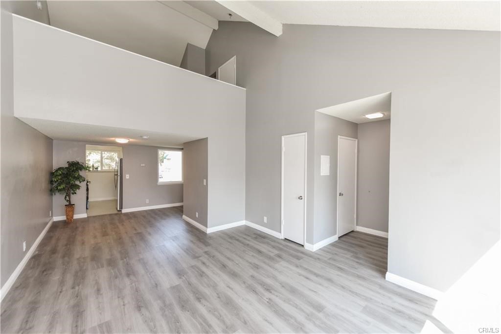 The community is undergoing an exciting facelift, with fresh updates designed to enhance the beauty and charm of each building. Many of the updates are already underway, with more improvements to come! This bright and airy upper-level 1BD/1BA condo offers a desirable two-level layout in a prime Santa Ana location, minutes from Downtown, Santa Ana College, and major freeways including the 5, 22, and 405. Main level, open living area with a soaring cathedral ceiling and abundant natural light. Upstairs owner's retreat with walk-in closet for added comfort and storage. Patio views, poolside relaxation, and garden strolls await. Secure gated entry, a shared garage, and easy access to the OC Streetcar and public transportation. HOA dues cover water and trash. All appliances are included, making this an excellent opportunity for first-time buyers, students, or investors.