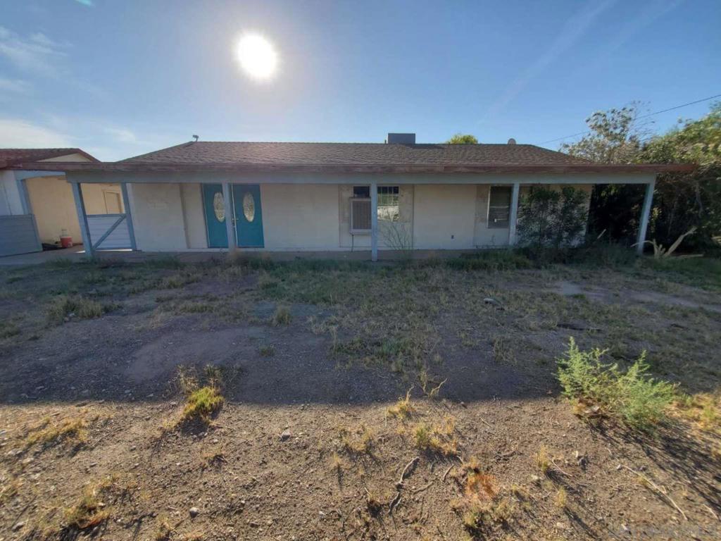 Don’t miss this rare find in Blythe: a move-in ready 3-bedroom home on a massive 1.17-acre lot offering land, privacy, and expansion potential! Located near the Colorado River, this property provides space for RV parking, a workshop, garden, or future additions — bring your ideas. The lot is fully fenced and offers mature trees, plenty of room for entertaining, and space for projects. The home features a functional kitchen, open living and dining areas, and a practical floor plan. One bedroom opens to an enclosed patio, perfect for additional living space or hobbies. The home offers two bathrooms: one with a jetted tub and another with a walk-in shower. Livable as-is, with room for cosmetic updates to build equity. Priced below comparable properties for a quick sale. Opportunities like this won’t last!