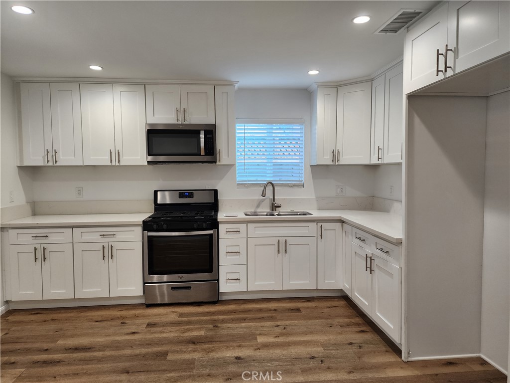 Detached family residence inside a secured and gated compound in the heart of vibrant North Hollywood. This lease is for a story house with 3 bedrooms, 2 bathrooms and a 3rd powder room on the 1st level. Fairly new construction. Easy to maintain flooring throughout, Corian kitchen countertops, range/oven, and microwave. There is a laundry area next to the kitchen with washer and dryer in place. Bright and airy with window blinds throughout. The living room has a sliding door that leads to a private yard. The main bedroom has an ensuite bathroom and a balcony.