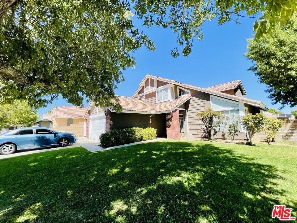 This is a fantastic opportunity to own your own home in Lancaster. This beautiful 4 bedroom, 3 bath home sits on a large corner lot. The rear yard is spacious. With the addition of a covered patio, it is perfect for entertaining guests or having peaceful quiet time with the ones your love. There may be room to park your RV. The inviting living room and dining room continue on into a beautiful kitchen that is very functional, while having a view of the back yard. One bedroom is downstairs, and the others are upstairs. There is a laundry area and a two car attached garage.