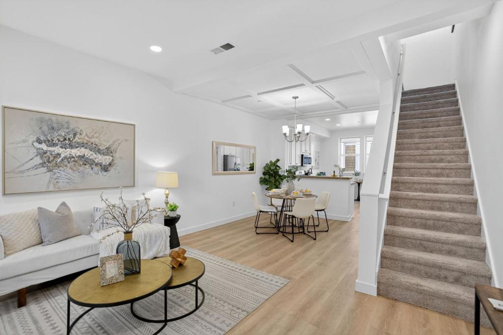 Welcome to 236 Grayson Terrace, located within the highly desired Cahill Park Community. This beautiful townhouse features 4 Beds, 2.5 Baths, and approx. 1,581 Sq Ft of living space. As you walk through the front door you are greeted by high ceilings + a light and bright open floor plan. Living area is spacious and opens directly to kitchen / dining area... perfect for entertaining! Updated kitchen with granite countertops, stainless-steel appliances, and freshly painted cabinets. New flooring on the main level gives this home a modern and updated vibe. New Interior paint throughout. Large primary bedroom with en-suite bathroom featuring double sinks. Three additional spacious bedrooms, one of which could be perfect for a home office or den / study area. Attached two car garage. Phenomenal location close to restaurants + whole foods on the Alameda, SAP Center, and the Diridon Station! Large park and playground just steps away! Do not miss this opportunity!