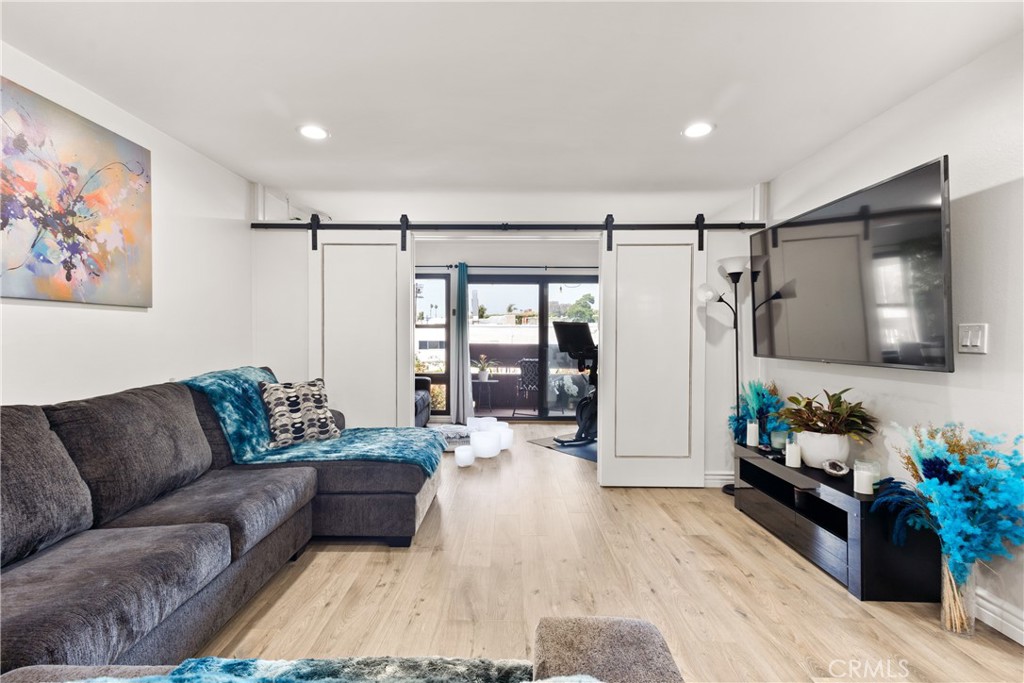 Indulge in the luxurious lifestyle of resort-style living with this extensively renovated condo 1-bedroom, 1-bathroom unit situated in Cross Creek Village in Playa Del Rey. Brimming with natural light, this spacious unit presents a generously sized living room adorned with recessed lighting. The addition of barn doors reveals a private guest area with a sofa bed featuring sliding glass doors that open to a private balcony. The kitchen has been tastefully updated, showcasing elegant quartz countertops, a custom tile backsplash, and custom cabinetry. Equipped with stainless steel appliances, this kitchen is a modern culinary haven. Immerse yourself in the abundant amenities offered by this lush community. Delight in the choice of two pools, tennis/basketball/paddle courts, and a playground. Maintain an active lifestyle with access to a fitness center complete with saunas, and changing rooms. Enjoy leisurely moments in the clubhouse, where pool and ping-pong tables are available for entertainment. The beautifully landscaped gardens and walking trails create a serene ambiance. Rest easy with 24/7 onsite security. Conveniently positioned near LAX Airport, shopping centers, schools, the beach, restaurants, bars, and a bike path, this unit provides the perfect combination of comfort and accessibility for a vibrant lifestyle.