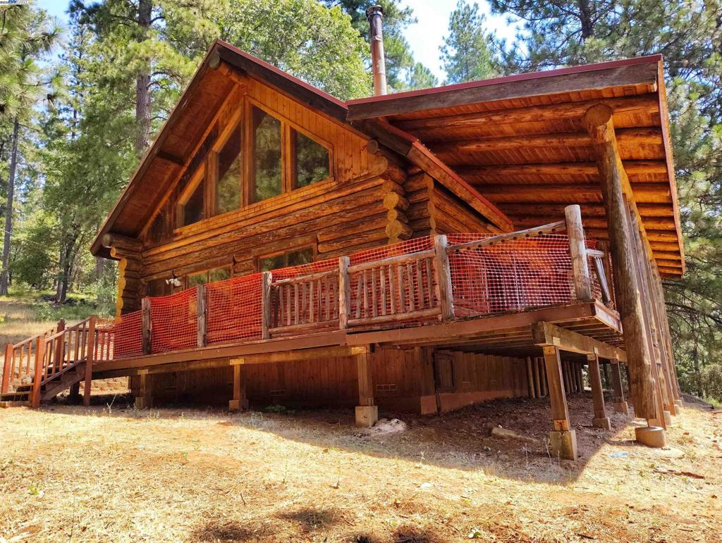 Tucked into the serene foothills of the Sierra Nevadas, 480 Ridge Road, in North San Juan offers the perfect blend of peaceful living and outdoor adventure. This log cabin style retreat has 2-Bedrooms, bonus Loft, 2 Bathrooms with 1476 square feet, wrap around deck, built in 1989, and sits on over 7.6 acres (331,056 square feet). Plenty of outdoor space for boats, RVs, cars, and land for agriculture or farm animals. Located just a few miles from Yuba River, Nevada City, Grass Valley, and Tahoe National Forest, this property puts you at the heart of Northern California's most visited outdoor destinations. Enjoy hiking, river swimming, arts and culture, and the best of small-town living—all from your private mountain home.