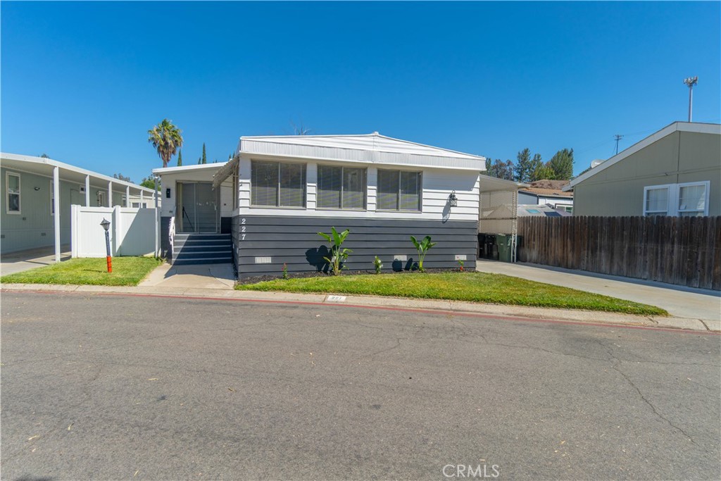 MUST SEE! TURN KEY CORONA MANUFACTURED HOME! This Upgraded Property is an OPEN FLOOR PLAN, 3 Bedroom 2 Bath Property and SHOWS BEAUTIFULLY! LOCATED IN THE HIGHLY SOUGHT AFTER GREEN VALLEY COMMUNITY! UPGRADED LUXURY VINYL FLOORING, NEW A/C UNIT, UPGRADED COUNTERTOPS, UPGRADED KITCHEN, REMODELED BATHROOMS, Elastomeric Roof Coating w/5 Year Warranty, OVERSIZED PARKING... This Home is TRULY A SPECIAL PROPERTY...THIS WILL GO FAST! (Space Rent $1768/month)