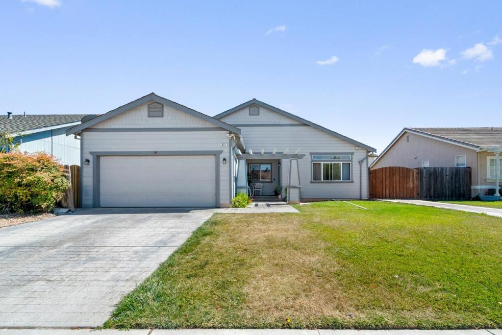 Welcome home at 921 Steinbeck! This home boasts a bright and large living area, large kitchen with beautiful counter tops, a fire place in the dining area, and a single level layout. With four bedrooms, two full bathrooms, and a large attached garage there is ample room for family living, roommates, or multi-generational living. The large backyard boasts beautiful concrete work, a lawn area, detached storage shed, and a large separate gated RV parking area. With close proximity to downtown, and walking distance to R.O. Hardin School and Hollister High School, this is a prime Hollister location.