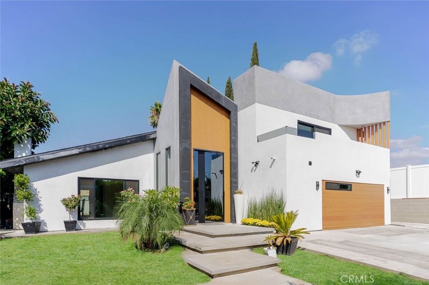 Welcome to this extraordinary home, a rare offering that combines luxury, versatility, and investment potential on a single expansive lot. With three separate addresses, this fully reimagined property features a stunning 4-bedroom main residence along with two brand-new 1-bedroom/1-bath ADUs, creating the perfect balance for multi-generational living, guest accommodations, or lucrative rental opportunities.



Every inch of this home has been completely renovated, showcasing new roof, flooring, plumbing, and electrical systems alongside high-end appliances, modern fixtures, and custom finishes. The main home's open floor plan boasts marble countertops, recessed lighting throughout, and a beautiful fireplace, blending warmth with sophistication. A dedicated wine cellar elevates the entertaining experience, while the seamless indoor-outdoor flow sets the stage for California living at its finest.



Once outside, you'll discover a private resort-style oasis, where a sparkling pool and spa take center stage. An outdoor kitchen and full outdoor bathroom create the ultimate entertaining space, perfect for gatherings under the sun or starlit evenings.



This remarkable property is more than a home, it's a turnkey estate with three addresses, endless flexibility, and modern luxury woven into every detail. A rare opportunity to enjoy refined living while unlocking income-generating potential, all within one prestigious residence.