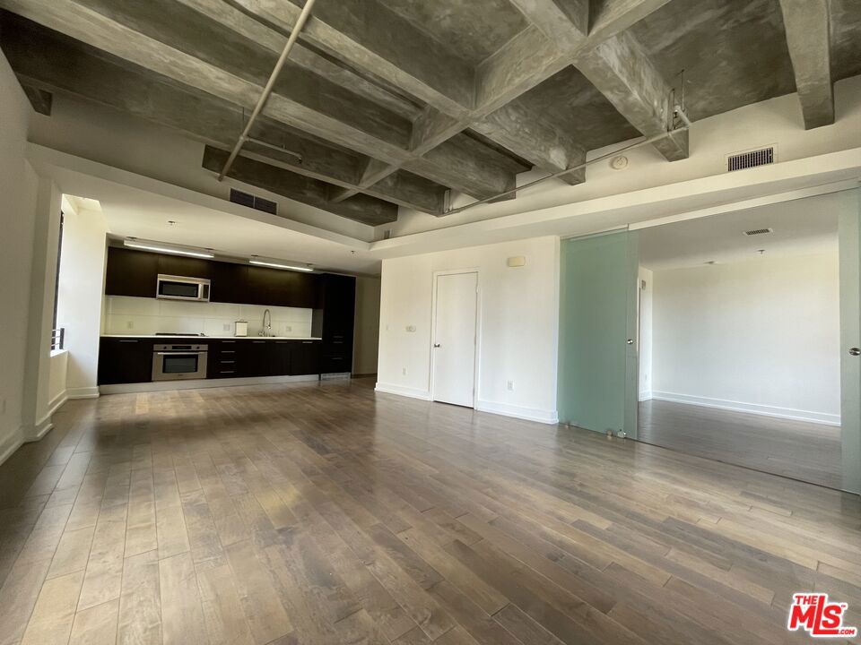 #907 is a corner loft with views south and west. "Look and Lease Special." Take up to EIGHTS weeks FREE rent on our exclusive move-in promotion. 4 weeks free, 4 weeks on 'Look and Lease" for total of 8 weeks free. Offer subject to change without notice, prices change weekly, book your appointment ASAP and ask for details on this promotion. We tour every day except SUNDAYS/holidays. ID is required. PET FRIENDLY BUILDING and low security deposits! Loft has lots of natural light through large windows with a view south. 24/7 gym, Parcel Pending secure locker system sends you a text you when you have a package to pick up, 24/7 Concierge and valet parking -text to retrieve your car-day or night! Bosch appliances; ranges, microwave, dishwasher, washer/dryer in all units, trash chutes on every floor. Pool, spa, indoor/outdoor shaded lounges, oversized TV and comfy sofas in community areas, wine room has private lockers and meeting area. Restaurants, bars, shopping, amenities within a short distance. Beautifully furnished guest suite/apartment can be rented by current Tenants for their visitors & guests - a great amenity! Whole Foods, Ralphs, Smart & Final, Target, Grocery Outlet are close by. Across the street is The Bloc shopping district featuring Uni-qlo and Macy's, bars and restaurants. Building is located above the 7th St/Metro Center red line that is a subway hub to all subway lines. One metro stop from LA Live, LA Convention Center. Tours available everyday except Sundays and holidays. IDs are required to tour. Agent to independently verify SF, lease rate and availability with leasing department. Many loft options available in bldg in all price ranges and SF. Prices and lease specials are subject to change weekly. Complimentary valet parking while touring.