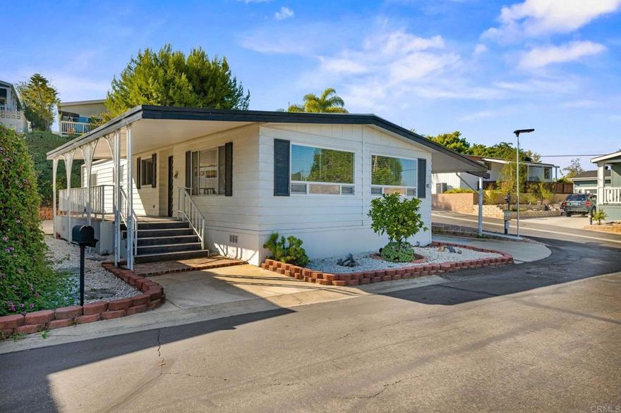 Welcome to the vibrant and sought after 55+ RESIDENT LAND OWNED mobile home community at Park Encinitas! This move in ready 2-bedroom, 2-bathroom corner lot home offers a comfortable and convenient lifestyle. The home is nestled in a 55+ Age-Restricted Community, ensuring a lively and engaging environment. The community offers a pool and spa for relaxation, and a clubhouse equipped with a library, billiards, kitchen, shuffleboard, and gym for your leisure and convenience. The interior of the home has been freshly painted and is equipped with air conditioning, laminate flooring in the main living areas, carpet in the bedrooms, and all necessary appliances, providing a hassle-free living experience. The property also includes a large front deck, a side yard, a 2-car tandem covered parking spot and a detached shed for additional storage.
