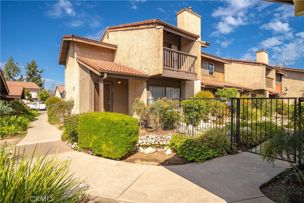 Beautifully updated 3-bed, 3-bath (one down stairs) townhome in the heart of Covina offering comfort, convenience, and modern style. The spacious living room features vaulted ceilings, a cozy fireplace, and sliding doors that open to a private patio—perfect for relaxing or entertaining. The kitchen includes stainless-steel appliances, crisp white cabinetry, and a breakfast bar that flows into the dining area for easy gatherings. Upstairs, the primary suite provides a peaceful retreat with an en-suite bath and generous closet space, while two additional bedrooms offer flexibility for a home office. An attached two-car garage,(to Patio that leads to the kitchen , laundry inside garage, and low HOA dues add everyday ease. Ideally located near Downtown Covina, Metrolink, parks, schools, and major freeways. Move-in ready and beautifully maintained—don’t miss this opportunity to own in one of Covina’s most convenient communities!