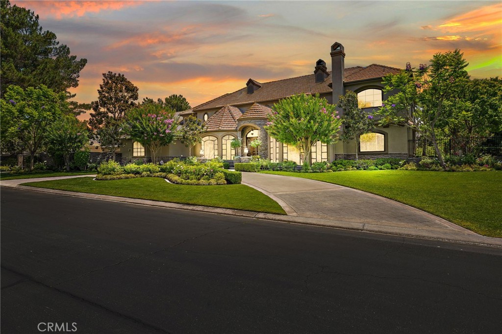 Welcome to 6 Hunter, a storybook estate nestled deep within the prestigious guard-gated community of Coto de Caza. Located in the exclusive Woods enclave and set on a quiet, single-loaded cul-de-sac, this rare legacy property offers a level of scale, privacy, and elegance that is truly unmatched. Positioned behind its own gated motor court on over an acre of manicured grounds, the estate spans approximately 7,300 square feet and features 6 bedrooms, 5.5 bathrooms, a 6-car garage, and a separate casita—perfect for multigenerational living, guest accommodations, or a private office. From the moment you arrive, you’re greeted by the soft scent of roses, towering magnolia trees, and lush garden beds designed with care and intention. Every pathway and corner invites you to explore and unwind, as nature and architecture blend seamlessly. Inside, the residence balances traditional craftsmanship with modern luxury. Grand-scale living areas, soaring ceilings, and designer finishes create a warm yet sophisticated atmosphere. Thoughtfully designed for both everyday comfort and elegant entertaining, the home includes a spacious main floor bedroom with ensuite bath, as well as a generously sized office that offers the potential to be transformed into a luxurious main-level second primary suite—ideal for guests, multigenerational living, or those seeking single-level convenience. At the heart of the home, an expansive bonus room becomes the ultimate gathering space—complete with a full bar and private balcony offering sweeping views of the surrounding hills and your own backyard paradise. Step outside and you’ll discover a private resort: a sparkling pool and spa, multiple sitting areas, and endless garden vignettes ideal for al fresco dining, quiet reflection, or lively gatherings under the stars. Car collectors and entertainers alike will appreciate the 6-car garage, gated parking, and generous guest accommodations. Every aspect of this estate has been crafted for those who value beauty, space, and serenity. This is more than just a home—6 Hunter is an experience. A rare opportunity to own a true estate property in one of Orange County’s most sought-after communities. Residents of Coto de Caza enjoy access to top-rated schools, miles of hiking and equestrian trails, and world-class amenities including golf, swim, pickleball, tennis, and a vibrant country club lifestyle thorough a variety of membership options.