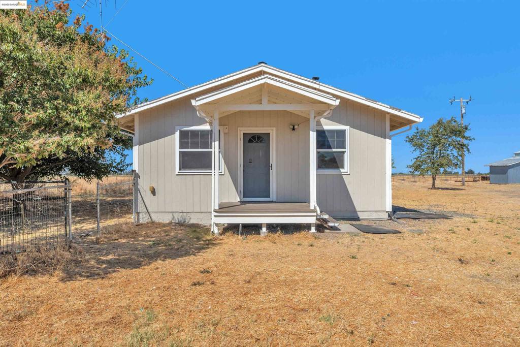 Charming 2-bedroom, 1 bath home sits on a 1.8-acre lot that offers abundance of space and privacy. There is also a massive 2,000 sqft shop that is perfect for a workshop, storage or creative projects. Enjoy the lush greenery with mature fruit trees. Plenty of room for RV, truck or boat parking. Despite the rural living, it is conveniently located with easy access to freeways, shopping, Sacramento Airport, and nearby casinos. This property blends country living with city convenience. Don't miss this amazing opportunity to own a property with endless possibilities.
