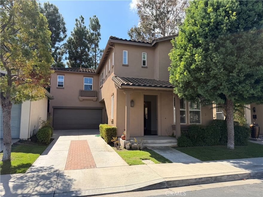 Beautifully situated home in the gated community of Oak Creek. The kitchen features granite countertops, white cabinetry, stainless steel appliances, and a center island that opens to the dining and family room. The family room offers a built-in entertainment center and direct access to the backyard and garage. Back yard has a nice, shady patio cover to enjoy. Upstairs includes a laundry room, built-in desk, three bedrooms, a hall bath, and a master bedroom with walk-in closet, dual sinks, soaking tub, and separate shower. Additional highlights include a long driveway for extra parking and a two-car garage. Walking distance to award-winning Irvine Oak Creek Elementary School. Close to UC Irvine, Concordia University, Irvine Valley College, and resort-style amenities such as pools, parks, tennis, and top dining and shopping within minutes to Irvine Spectrum.