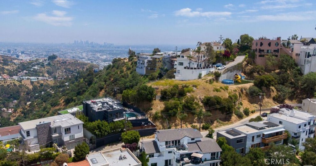 Are you ready to build the home of your dreams? This prime location provides a rare opportunity to design and construct a custom residence from the ground up. Utilities are available in the street and ready for connection, making the development process even more seamless.
Whether you're an investor or future homeowner, this is your chance to create something truly special in one of L.A.'s most iconic neighborhoods.
Situated just minutes from the world-famous Sunset Strip, this exceptional lot in Hollywood Hills West offers the perfect blend of privacy and accessibility. Enjoy the best of Los Angeles living—close to premier shopping, dining, and entertainment—while surrounded by natural beauty and panoramic city views.