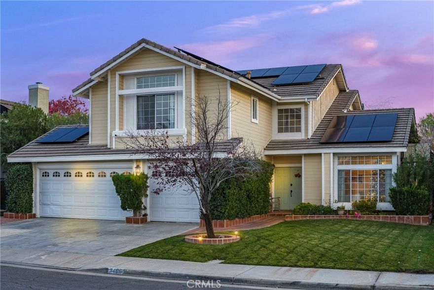 Beautifully situated on a quiet Westside cul-de-sac just moments from Rancho Vista Park and the Rancho Vista Golf Club, this stunning 5-bedroom, 3-bath, 3-car garage home offers sky-high ceilings, light-filled living spaces, and an open floorplan accented with natural hardwood floors inside. A grand foyer leads to the spacious living and dining areas, while the inviting family room features a warm wood-burning fireplace. The huge kitchen boasts stainless steel appliances, abundant counter and cabinet space, and a center island overlooking the resort-style backyard. Upstairs, the primary suite welcomes you with double-door entry, a soaking tub, walk-in closet, and separate shower, accompanied by three additional bedrooms and a full bath. The fifth bedroom and a ¾ bath are conveniently located downstairs—perfect for guests or a home office. Step outside to an entertainer’s dream yard complete with a sparkling pool featuring a slide and diving board, a full-length covered patio, a balcony, and a built-in BBQ. Reach out for a private viewing and make this stunning Rancho Vista property your next home.