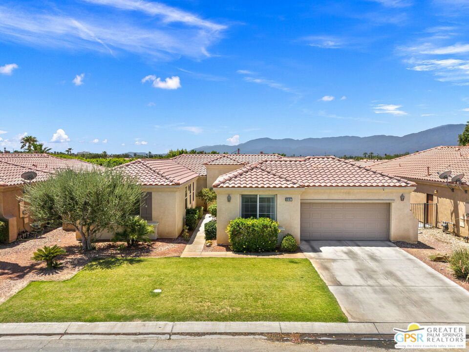 Welcome to The Desert Collection, a gated hideaway in desirable North Indio where style, space, and sunshine come together. This single-story stunner offers 4 bedrooms and 3.5 baths, including a detached casita, all wrapped in a layout made for easy living and effortless entertaining. Step through the private courtyard and into wide-open living and dining areas centered around a double-sided fireplace, an unexpected architectural touch that sets the tone. The kitchen is sleek and social with quartz countertops, counter seating, and smart updates throughout. Outside, the south-facing covered patio opens to a private yard with a built-in barbecue, creating the perfect backdrop for quiet mornings or lively evenings. The primary suite is spacious and serene, with direct backyard access, a walk-in closet, and a spa-style bath with soaking tub, dual vanities, and separate shower. Guest bedrooms two and three share a stylish Jack and Jill bath, and a powder room adds extra convenience. The detached casita in the front courtyard is the ultimate flex space or guest escape with its own private bath. Custom shutters, updated lighting, and a brand new app-controlled garage door system elevate the details. A dedicated utility room with built-ins adds function, while low-maintenance landscaping keeps things simple. Low HOA, no Mello Roos tax, and The Golf Club at Terra Lago just minutes away. Take the Matterport Virtual Tour to see how this one really lives.