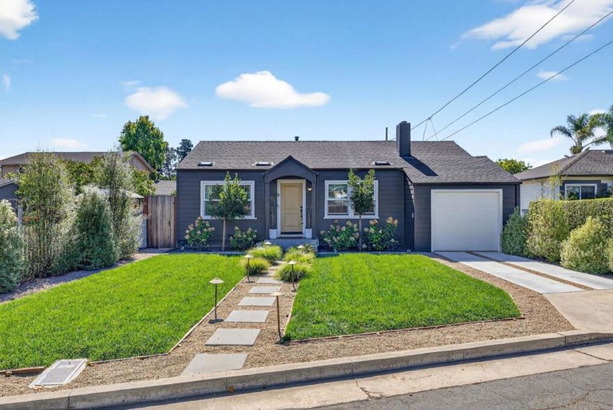Welcome to 916 Melrose Avenue in Santa Cruz, a beautifully updated 2 Bed & 2 Bath home offering 1,229 sq ft of living space on a 5,140 sq ft lot in the highly desirable Banana Belt neighborhood. Thoughtfully remodeled, featuring a new roof, siding, paint, furnace/ducting, Milgard dual-pane windows, and a NEM2.0 4.345kW solar system with Tesla charger. Inside, refinished white oak hardwood floors and West Elm lighting set a modern tone. The living room boasts a wood-burning fireplace, while the kitchen impresses with quartz counters, farmhouse sink, walk-in pantry, and premium Samsung/GE appliances. Both bathrooms were fully remodeled in 2024 with marble tile, new vanities, and custom showers. The primary suite opens directly to the backyard, where Trex decking, a gazebo lounge with built-in heater, and lush landscaping with smart irrigation create an ideal space for relaxing or entertaining. The attached garage offers excellent storage with built-in cabinets, a loft, GE washer/dryer, and a Navien tankless water heater. Located less than 2 miles from Seabright and Twin Lakes beaches, near Arana Gulch trails, shops, and walking distance to top schools, this turnkey home delivers the best of Santa Cruz living.