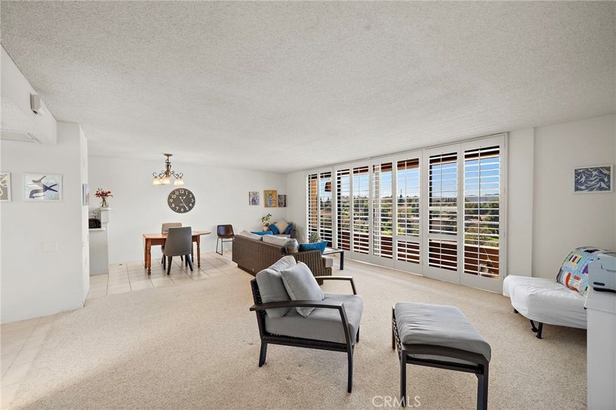 This is a highly sought after "G" floor plan at the Towers, with gorgeous views of the Southern California Sunsets!  This home has a huge bedroom and 1.5 bathrooms.  The dining room and living room lead to the step out balcony that runs the length of the home.  The kitchen has been remodeled and features a 2 burner cook top, fridge plus an added bar with more storage and counter space. The master bedroom is massive and has a walk in closet plus a slider to the deck and an en suite bathroom with shower.  The home also features a convenient guest half bathroom at the entry.  Located in Laguna Woods, a SENIOR community, the Towers features many amenities.  Currently INCLUDED in the monthly fee are: a monthly $500 dining credit to use in the 2 dining rooms, housekeeping, electiricty, water, trash, basic cable, plus on site activities: live entertainment, bingo, movies, exercise classes, card rooms, parties & more! Living in Laguna Woods means access to a bus system around the community, to area shopping, restaurants, medical facilities; 5 pools & 4 hot tubs; 27-hole golf course, tennis, library, state-of-the art crafts facility, 7 clubhouses, 200+ clubs, 3 fitness centers, theater, horseback riding/stables, garden centers, basketball, billiards, bocce ball, Emeritus classes & more! Come enjoy resort style living at its best!