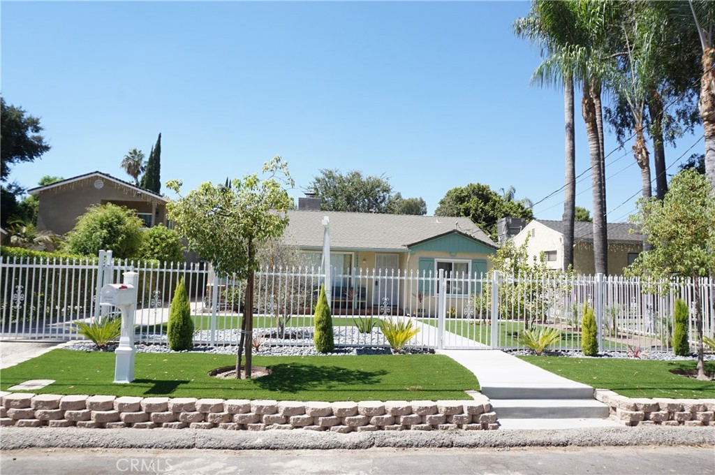 Charming gated Single-Story Home for Rent in Chatsworth! This spacious 3-bedroom, 2-bathroom home offers 1,468 sq. ft. of comfortable living space. New turf with low-maintenance, drought-tolerant landscaping. Step into a bright and welcoming living room featuring a cozy fireplace, fresh paint, new carpet, recessed lighting, and dual-pane windows. The kitchen boasts ample cabinet space with timeless charm, granite countertops, and includes a cooktop, oven, dishwasher, and refrigerator. Adjacent to the kitchen, the oversized family room showcases built-in bookshelves, laminate flooring, and a cheerful breakfast nook with plenty of natural light. The primary bedroom has its own private entrance and ensuite bath, while the two additional bedrooms feature new carpet, ceiling fans, recessed lighting, and share a full bath with tub and shower. Central AC/heat, long driveway with detached 2-car garage. Spacious backyard with covered patio – perfect for outdoor enjoyment. Prime location with easy access to the 118 freeway, Metrolink, shopping, dining, grocery stores, coffee shops, entertainment, and just minutes from Westfield Topanga Mall & The Village. Sorry, no pets!