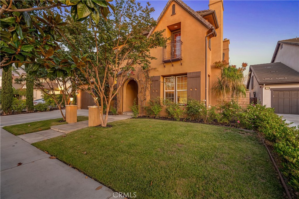 Step into timeless elegance and modern comfort in this one-of-a-kind Tuscan-style North Santa Ana estate, where sophisticated living meets artisan craftsmanship. With 5 spacious bedrooms, 4.5 bathrooms, a dedicated den/office, and private in-law quarters, this 4,566 sq ft residence is a showcase of warmth, beauty, and luxurious detail. The home welcomes you with custom onyx travertine flooring, rich Venetian plaster walls, and artisan touches throughout, including a Tiffany-style chandelier in the cozy formal living room, adding just the right touch of old-world charm and elegance. Three fireplaces, two of them dual gas and wood-burning that create a cozy ambiance throughout the main level, perfect for relaxing or entertaining. The heart of the home is the gourmet chef’s kitchen, featuring a brand-new $40,000 Thermador appliance suite, stunning granite countertops, and an airy, open layout that flows effortlessly into the family and dining spaces. French double doors invite you outdoors to an entertainer’s dream yard. The primary suite is a private sanctuary, starting with a separate sitting room with a fireplace, then stepping up into a grand 16’ x 20’ master bedroom private retreat with vaulted wood beam ceilings. The warm wood details continue throughout the home, adding a rustic elegance that echoes the best of Tuscan architecture. Outside, you’ll find a professionally designed $250,000 backyard retreat, offering a perfect balance of serenity and style: Over 1,800 sq ft of covered patio space for year-round enjoyment, 10-person above-ground spa nestled in a private courtyard, 10-person Finnish cedar wet sauna on a custom-built deck, 6-ft hand-hammered copper fire pit filled with turquoise fire glass for unforgettable evenings, Young fruit trees including apple, Asian pear, avocado, lime, and lemon, lush flowering gardens with roses and other seasonal blooms, adding color and fragrance throughout the year. This home offers the perfect setting for multigenerational living, stylish entertaining, or peaceful, everyday luxury, all within a beautifully curated and thoughtfully designed residence.