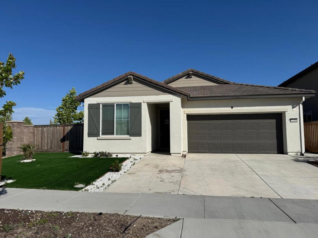 Welcome to this charming 4-bedroom, 2-bathroom home located in the vibrant city of Lathrop. Spanning 1,733 square feet, this residence offers a spacious and functional layout. Corner lot with no homes on the back and left side, offering unique privacy. Newly built in 2023, close to Highways, all the famous restaurant chains, super markets and much more. The heart of the home is the well-appointed kitchen, ideal for cooking and entertaining. All the appliances are included. The home features central forced air gas heating, ensuring comfort throughout the seasons. Practical amenities include an inside laundry area equipped with a washer and dryer, adding convenience to daily routines. Low maintained front and back yard beautified with concrete, synthetic grass, rocs and plants. Beautiful Patio to spend summer evenings or enjoy winter sunny days. This property provides ample storage space with a 2-car garage. Paid solar system will give you big relief on electricity bills. Set on a minimum lot size of 5,941 square feet, there is plenty of room for outdoor activities. The home is situated within the Manteca Unified School District. This property combines comfort, convenience, and location, making it a perfect choice for your next home.