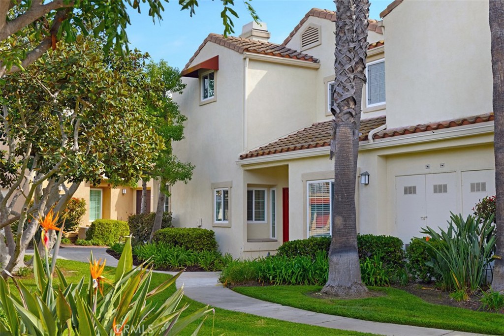 Interior location, end unit townhouse with a view of the community green belt. Ample parking just a few steps away. This very well-maintained property with plank faux wood tile flooring throughout the first floor, fresh interior paint, light and bright open floor plan with access to an enclosed patio, open kitchen with lots of storage, Stainless steel appliances and eat-in nook with slider to patio. Living room with cozy fireplace opens to the dining room. One Bed down with adjacent full bath, 2 beds up with in-suite baths, master with large walk-in closet. Chandon association with pool and spa as well as the Marina Hills association amenities including, Olympic sized pool, spa, club house and tennis courts, water paid. Salt Creek trail is just steps from your front door that will take you down to two 5 star resorts with golf and dining and one of Orange counties premier beaches. Walking distance to shopping, dining and community services.
