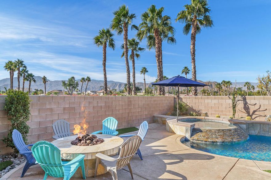 STUNNING QUALITY REMODEL! Discover luxury living in this beautifully renovated Balboa model featuring 3 bedrooms (two primary bedroom suites) and 3 baths. This west-facing gem offers breathtaking mountain views from the expansive private patio, complete with a pool, spa with rock waterfall, built-in BBQ, firepit, and shaded outdoor living space with fans & automatic sunshades--perfect for entertaining!  Inside, enjoy a modern open-concept floor plan with high ceilings and wood-like tile flooring throughout. The gourmet kitchen boasts sleek contemporary cabinets, Thermador appliances, quartz countertops, a full backsplash, and a walk-in pantry. The living room features a resurfaced floor-to-ceiling gas fireplace, while the dining area includes a picture rail for your favorite artwork. The first primary suite offers a large walk-in closet and a spa-like ensuite bath with a custom-tiled oversized shower. The second primary suite includes two large closets and a tub/shower with tile surround. The home also features a Murphy bed in the office/third bedroom, whole-house water filtration, an epoxy-floor garage with storage, and an insulated door. Located in the gated Indian Springs Golf Club, enjoy low HOA dues, covering guard-gated security, front yard maintenance, cable/internet, a fitness center, lap pool, and more. Close to top-rated schools, premier shopping, dining, and the Indian Wells Tennis Center!  Don't miss this fully upgraded, move-in ready home in a prime location!