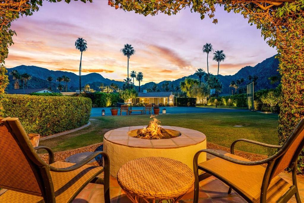Step into your own slice of paradise within the La Quinta Country Club Golf Estates! This stunning home offers an exclusive lifestyle with a private pebbleTec pool and tennis courts shared by only three other homes. Imagine waking up to breathtaking views of the Santa Rosa Mountains, palm trees, and lush greenery, all from the comfort of your backyard. Whether you're relaxing by the fire pit on your patio or enjoying the shade of your private courtyard, every moment here feels like a luxurious getaway.Inside, the spacious layout is designed for both comfort and style. The chef's kitchen boasts stainless steel appliances, ample storage, and a cozy dining nook. The primary suite is a true retreat, featuring dual sinks, a massive walk-in closet, and private access to the patio. Two additional suites offer generous space and walk-in closets, perfect for family or guests.This home is the epitome of luxury and tranquility, offering everything you need to live life at its finest. Opportunities like this are rare--don't wait! Claim your personal piece of paradise today before it's gone!