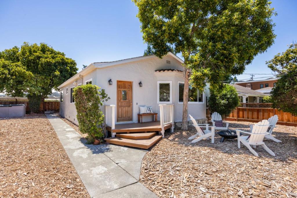 STUNNING MENLO PARK SMART HOME - MOVE-IN READY! This completely remodeled bungalow combines luxury living with cutting-edge technology. Featuring a gleaming modern kitchen with high-end appliances including KitchenAid gas/electric range, plus remodeled bathrooms, new floors, paint (interior/exterior), and recessed lighting throughout. PREMIUM TECH FEATURES: * Whole-home audio with in-ceiling speakers ($900 each) * Enterprise-grade networking with Ethernet to every room * 65" LG OLED TV ($6000, can stay or go) * Radiant floor heating for ultimate comfort ENERGY INDEPENDENCE: * 5.4kW solar panels + dual Tesla Powerwalls deliver exceptional savings and blackout protection. WORKSHOP PARADISE: Finished detached garage with sink/skylights, 3HP air compressor, plus tent-covered carport. Basement provides easy access to utilities and storage. INCREDIBLE STORAGE: Finished insulated attic with pull-down ladder maximizes space. EV READY: Two charging stations installed. PRIME LOCATION: Menlo Park address with top-rated Menlo-Atherton High School. This turnkey smart home offers luxury, efficiency, and unmatched convenience. Don't miss this rare opportunity in coveted Menlo Park!