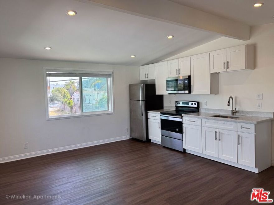 Step into the essence of Santa Monica living with this beautifully remodeled second-floor corner unit, featuring vaulted ceilings and sweeping views of the Santa Monica Mountains and city skyline. This 1-bedroom, 1-bathroom apartment embodies the laid-back coastal lifestyle just minutes from the ocean. Inside, this apartment has been thoughtfully upgraded with sleek flooring, modern kitchen appliances, and stylish fixtures throughout. Natural light pours into the open living space, creating the perfect atmosphere for relaxing or entertaining. The spacious bedroom offers a peaceful retreat, while the updated bathroom completes the fresh, modern design. Enjoy added convenience with a community washer and dryer, plus one dedicated parking spot. There is a community BBQ and outdoor space. Located near Santa Monica College and just a short distance from the beach, shopping, dining, and parks, this apartment places you right in the heart of everything Santa Monica has to offer. Utilities (water, gas, and electricity) are included. Call or text for pet rules.