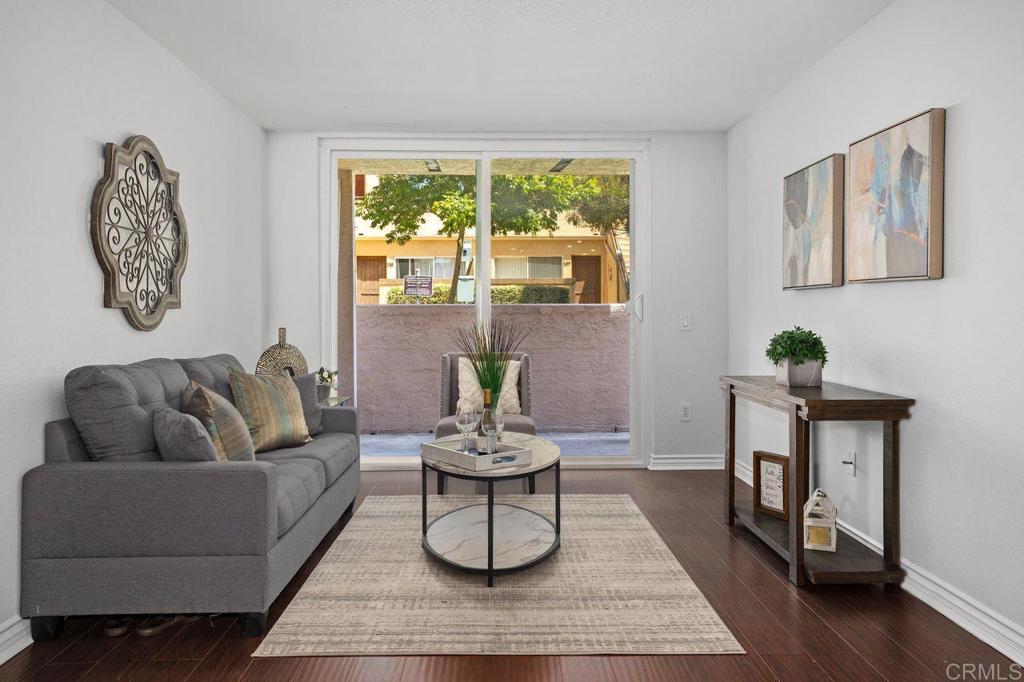 Welcome to this beautifully upgraded ground-level corner unit in the heart of University City! Ideally situated in a private location within the complex, this turn-key, move-in ready condo offers the perfect blend of comfort, style, and convenience. Enjoy proximity to UCSD, Scripps & Sharp Hospitals, world-class shopping, top-rated restaurants, parks, beaches, and major freeways—making this a prime location for both work and play. Step inside to discover a light-filled open floor plan featuring new interior paint, durable hardwood flooring, and a spacious living area that flows effortlessly into the dining and kitchen spaces. The kitchen is tastefully appointed with granite countertops, shaker-style cabinetry, and a breakfast bar, offering plenty of space for cooking and casual dining. Enjoy the tranquility of your generous private patio, accessible through sliding glass doors from the living room—ideal for relaxing or entertaining. Additional features include one assigned covered parking space and access to resort-style community amenities such as a pool, spa, fitness center, tennis courts, BBQ area, and EV charging stations. HOA dues are just $190/month and cover water, sewer, trash, and maintenance of the common areas, including the pool, spa, tennis courts, BBQ area, and more. This charming home is the perfect blend of comfort and convenience in one of San Diego’s most desirable neighborhoods. Don’t miss this wonderful opportunity!
