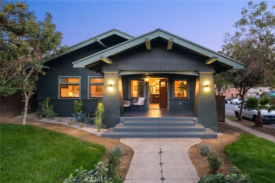 This is one of those special homes that the moment you step foot inside you will feel its magic! Romantic, timeless & breathtakingly beautiful, circa 1908, this spacious 4 bed 3 bath Craftsman dream awaits the next chapter to its ever evolving story. Located on a lovely tree lined street in the heart of LA's highly sought after Jefferson Park neighborhood this sweet home has been painstakingly restored and customized down to every last detail. Every inch of the home has undergone thoughtful restoration or been totally rebuilt from the architectural details to the brand new foundation, roof, and systems throughout. It;'s a perfect blend of soulful, historic character and meticulous modern craftsmanship. Upon entering the lush front lawn you'll be met by a large covered front porch that offers an idyllic setting to sip coffee morning coffee in the shade! A dramatic restored wooden door leads you into an easy flowing floorplan surrounded by beautiful wood windows with rich wood floors spanning throughout. A charming built-in window seat, custom design elements and an abundance of natural light  are just a few of the exceptional features that make each space so remarkable. The bright chef’s kitchen is a true centerpiece, boasting top of the line appliances, a hand crafted island and custom cabinetry. Two of the four spacious bedrooms are ensuites with gorgeous attached bathrooms and are located exactly where you'd want them to be in a layout that maximizes space and comfort. The main primary suite is nothing short of epic and serves as a truly elegant refuge to unwind in at day's end. The hall bathroom features a separate shower and soaking tub, perfect for family and guests. Outside a fully fenced backyard with lush and private landscaping as well as a custom-built deck—offer an extraordinary setting for dining al fresco, lounging and magical family memories galore. A large finished detached garage with side sliding doors also provides awesome versatility for a work from home, creative / play space or future ADU! From the emotion evoking architectural beauty to the peace of mind of all new systems and the culturally rich and booming location, rare gems like 2396 W 31st st don't come along too often!