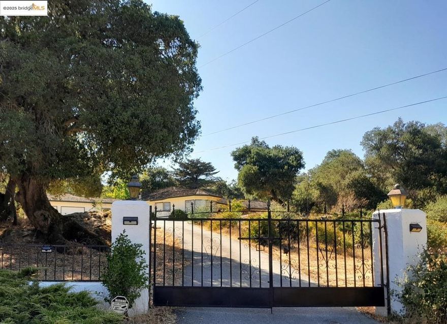 Santa Clara Valley Wine Trail custom home on nearly 3 tranquil useable acres near west Morgan Hill. This charming 1950's 2322 sq. ft. home has a great footprint for remodeling or future expansion. Mountain and valley views, horses allowed, no HOA. Large rooms, large windows, and high ceilings throughout. Custom craftsmanship, custom cabinetry, rare mahogany wood, walk-in storage room, generously sized kitchen (with extra counter space, extra cabinetry freshly painted, 2 large sinks, ample dining area, spacious "family room area" and a "scullery style" cooking area). Newer water heater. Heritage oaks and stunning natural rock formations. Garage has covered breezeway, small bathroom and large storage room. Secondary bedroom has walk-in closet plus small bonus room attached. Large formal living room with fireplace (potential 4th bedroom). Custom pool/spa. Home has limited update(s).