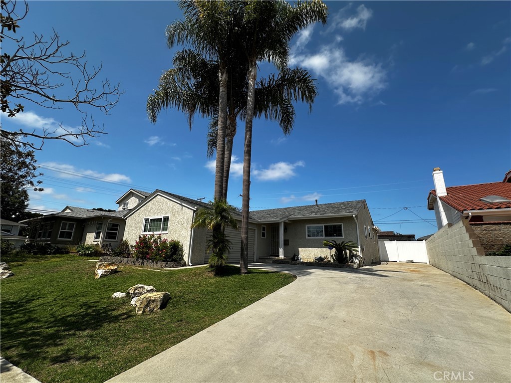 Beautiful South Torrance home located near award-winning schools, including Arnold Elementary, Calle Mayor, and South High School. This inviting residence offers 3 bedrooms and 1.75 baths, with a full bath featuring a tub and a separate bathroom with a shower. The L-shaped kitchen provides ample counter space and direct access to the two-car garage. The living room flows seamlessly into the dining area and a spacious family room with vaulted open beam ceilings and a cozy fireplace. The family room opens out to a covered patio and backyard, ideal for outdoor entertaining. Additional features include a large driveway plus a second driveway for Boat/RV parking, laundry hookups in the garage, central heating and A/C, and low-maintenance landscaping. Sorry No pets allowed. Excellent FICO scores required.