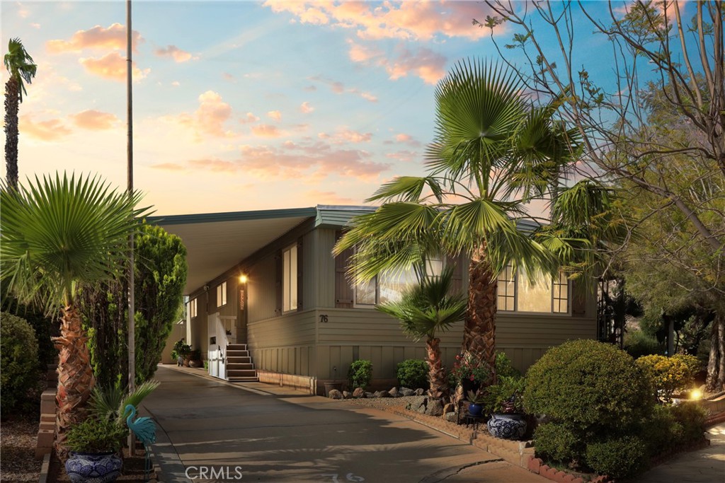 **AMAZING VIEWS - 55+ COMMUNITY** Beautifully upgraded home with a desirable location in the park. This gorgeous 2bd/2ba home features a 2yr old interior remodel including new flooring throughout, new bathrooms (vanities, counters, fixtures, hardware, tubs/showers); new kitchen (appliances, cabinets, counters, fixtures); interior texture and paint throughout; new light interior and exterior light fixtures, including under cabinet indirect lighting.
The entire exterior was painted 6 months ago with new exterior shutters, new indoor/outdoor carpet on steps and raised patio with new aluminum trim. Also added is a 2 year old HVAC system – full residential system with NEST; not mobile home system. The home also features a 2 year old complete repipe with PEX and a 3yr old roof.
This unit is located in the largest space of Panorama Cove, Open space behind – including Pride Rock from the Lion Kin. There is a landscaped vacant lot on side with right of use. This place is beautifully landscaped with a fenced yard for your furry friends including a doggy door. The backyard is perfect for entertaining, backs up to an open space with no direct neighbors behind you.
Panorama Cove has the lowest space rents in Hemet