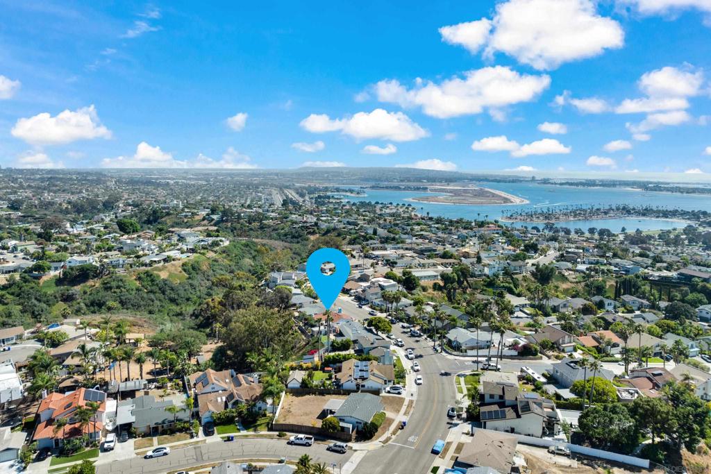 Golden Opportunity for a turn key home in Bay Park on a nearly 1/4 acre canyon lot(private with no public access). View of ocean from front porch. The skylight makes for a bright kitchen, which also features top grade maple cabinets, granite counters, and stainless steel appliances. There are also dual pane windows, paid off solar system(seller had a credit last year!), beautiful hardwood flooring, and big family room with vaulted ceilings and wood burning fireplace. There are two driveways including room for boat, RV, or ? Enjoy the canyon view from the backyard near the gas fire pit or covered trellis. Located minutes to Mission Bay, this is an ideal location.