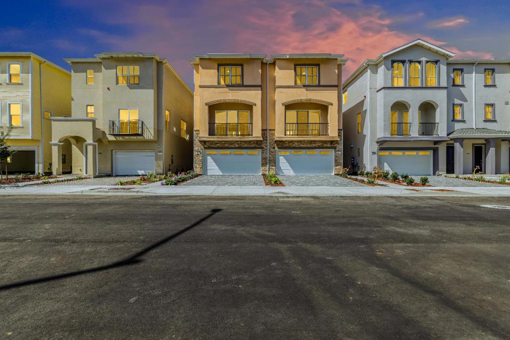 Welcome to Pacific Sunshine, a sought-after new home community where natural splendor meets contemporary comfort. This sophisticated three-level is set beside the picturesque Wetlands of Watsonville, offering a serene backdrop rich in outdoor recreation. Step into a thoughtfully crafted entryway that sets a warm, elegant tone. The ground floor includes a private ensuite bedroomideal for guests or multigenerational livinga spacious two-car garage with ample storage leads topeaceful rear yard, perfect for relaxation. The main level features a bright, open-concept design for daily ease and stylish entertaining. A gourmet kitchen boasts upgraded appliances, a generous island, and sleek cabinetry. The dining area and great room flow to a front balcony, promoting seamless indoor-outdoor living. A modern powder room and versatile alcove enhance the space.Upstairs, retreat to the refined primary suite with a walk-in closet and spa-inspired bath featuring dual vanities and a freestanding shower. A second ensuite bedroom near the laundry area ensures privacy. Smart upgrades include two electric water heaters for efficiency and CAT-5 wiring. Enjoy close proximity to downtown, shopping, scenic trails, and a tranquil bird-watching lookoutperfect for a lifestyle in nature and wellness.
