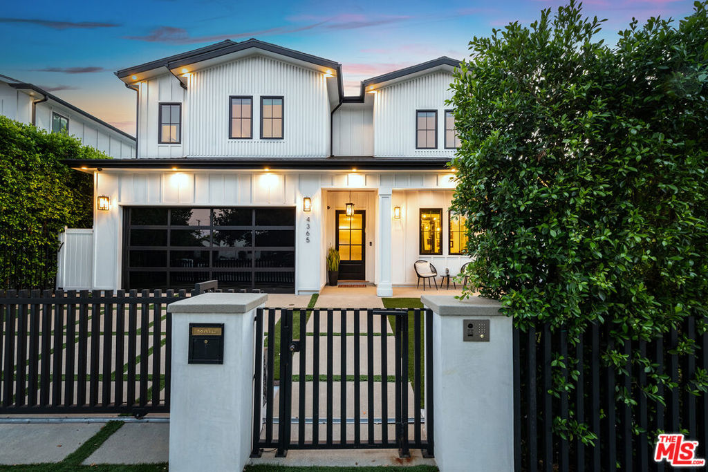 Luxury, location, and lifestyle converge at 4365 Kraft Avenue, an exceptional custom built residence in the highly coveted Colfax Meadows neighborhood, just a stone's throw from Tujunga Village and located within the prestigious Carpenter Elementary School District.Step through the dramatic entryway into a world of refined elegance, where soaring ceilings, wide planked hard wood floors and a striking accent walls immediately set the tone. The open floor plan is thoughtfully designed for elevated living and effortless entertaining. The sophisticated formal living room is anchored by a sleek black marble fireplace and custom built-ins, flowing seamlessly into the formal dining room, an ideal setting for hosting memorable gatherings.The heart of the home is the stunning gourmet kitchen, outfitted with top tier appliances, a striking waterfall edge island, custom cabinetry, and a new kitchen hood. The kitchen opens to the expansive great room, where oversized sliding glass doors blur the line between indoors and out, inviting natural light and effortless flow to the beautifully appointed outdoor living space. The resort-like backyard, an entertainer's dream featuring a sparkling pool and spa, covered patio, built-in BBQ, retractable awnings, and lush landscaping. Recent upgrades include new hanging electric heaters, landscape lighting, and elegant crown molding to discreetly conceal outdoor wiringmaking the space perfect for year-round enjoymentAlso on the main level, a stylish home theater offers the ultimate cinematic experience with a 13-foot custom-designed sofa featuring four luxurious recliners, a custom media cabinet topped in black stone, upgraded surround sound, a sophisticated TV/media system, and an upgraded beverage cooler. Across the hall, a glass-enclosed home office adds a modern touch of professionalism with built-in glass cabinetry, ideal for working or learning from home. An en suit bedroom and chic powder room, completes the first level.Upstairs, the primary suite is a true sanctuary featuring vaulted ceilings, a private balcony, and a spa-inspired bath with a soaking tub, glass-enclosed shower, dual vanities, electric roller shades, and custom bedside sconces. Four additional bedrooms and bonus room provide ample space for family or guests, and a generous upper-level den offers a versatile lounge, play, or study area.Elevating comfort and convenience is a cutting-edge, all-glass Stiltz elevator, offering seamless access to all levels of the home.Additional features include solar panels, smart home integration, an advanced security system, custom window treatments, and a finished two-car garage with built-in storage and an automatic ventilation fan.With its rare combination of luxury design, modern comfort, and prime location near Studio City's best dining, shopping, and schools, 4365 Kraft Avenue delivers the pinnacle of Southern California living. Also available for lease at $29,500/mo.