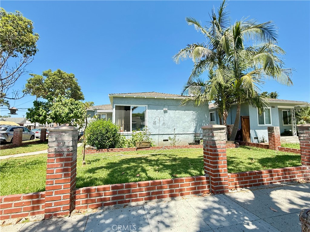 Ready to make your own and with room to expand. Seller has recently renovated the kitchen, installed new flooring installed new ceiling fans and painted the interior. All windows are updated dual pane and the roof is only 5 years old. Larger corner lot features a detached garage that has the laundry room attached as well as two bonus rooms! RV parking allows for additional parking if garage were to be considered for an ADU. Large living room has a fireplace and lots of natural light.