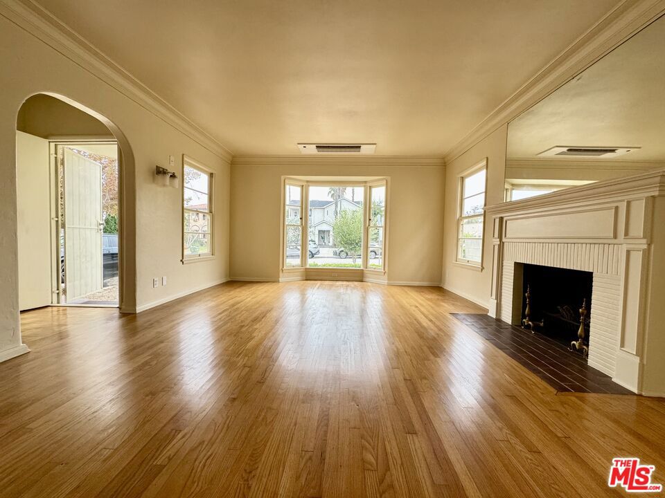 This charming 2+2 Single Family Home is situated in one of the greatest locations in town! A timeless 1940s residence, cared and loved for over 70 years by the same family, is now inviting you to come and live here! 1,288 sq. ft. of living space featuring hardwood floors, natural light fills the inviting living room with decorative fire place. This home sits on a 6,551+/- sq. ft lot, providing a detached garage with long driveway. Easy access to shops, restaurants, museums, The Grove, and just blocks away from Cedars Sinai Hospital, now available FOR LEASE, and ready for you to move in. Just a few steps away form Melrose Avenue and adjacent to Beverly Hills. Call to schedule private showing.