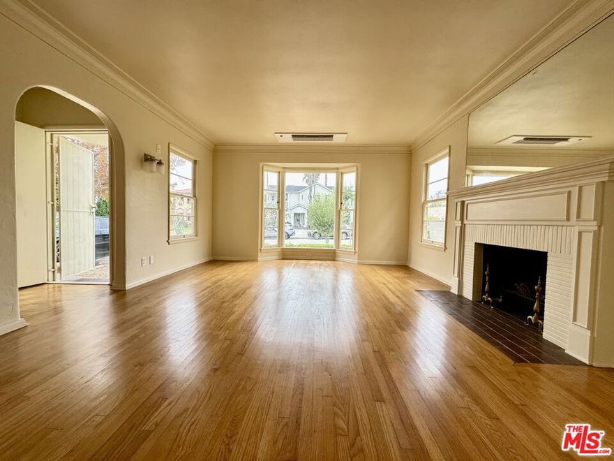 This charming 2+2 Single Family Home is situated in one of the greatest locations in town!  A timeless 1940s residence, cared and loved for over 70 years by the same family, is now inviting you to come and live here!   1,288 sq. ft. of living space featuring hardwood floors, natural light fills the inviting living room with decorative fire place.   This home sits on a 6,551+/- sq. ft lot, providing a detached garage with long driveway.   Easy access to shops, restaurants, museums, The Grove,  and just blocks away from Cedars Sinai Hospital, now available FOR LEASE, and ready for you to move in.  Just a few steps away form Melrose Avenue and adjacent to Beverly Hills.  Call to schedule private showing.
