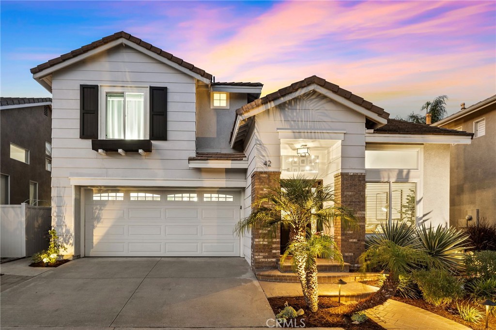 Seriously....THIS IS THE ONE YOU HAVE BEEN WAITING FOR! Complete Perfection and both agents and buyers will LOVE it!! A wonderful quiet location, great appeal from the street and a FABULOUS back yard! (substantially bigger than most with beautiful landscape and lawn!) Inside it is PICTURE PERFECT with absolutely everything you want in a home! Gorgeous wood flooring, soaring ceilings in the LR and DR - SO BRIGHT, happy and beautiful with loads of light! You'll love the custom entry door and side light and gleaming white walls! The GREAT ROOM is on the back of the home with a really SPACIOUS family room and fireplace - and don't miss out on the amazing use of cabinets under the stairway! Currently there is an ADORABLE little 'clubhouse/hideout' as well as cabinets and storage. Add in a convenient casual dining area, slider to the beautiful and quiet rear yard, and a dreamy kitchen with incredible and beautiful concrete counters, kitchen island, exquisite marble backsplash, under-cabinet lighting, beautiful high quality white cabinets, and plenty of them with LOADS of counter space. This kitchen will be an absolute JOY to be in with a clear view to the back yard. There is also direct access to the 2 car garage off the hall way and a guest bath. The property has been re-piped and there is wonderful custom lighting in the front and rear yards adding warm touches that make it great for entertaining and relaxing. Add in a stunning stairway, and FOUR bedrooms UPSTAIRS! 3 good sized bedrooms PLUS a wonderful primary suite and bath with gleaming tub, large separate shower, and a walk in closet. The laundry is UPSTAIRS..... where all laundry should be... and the washer and dryer are included. The schools are wonderful with top ranked Canyon Vista Elementary School that is highly sought after, as well as excellent middle and high schools too! There are 2 wonderful parks close by and please note NO HIGH ASSOCIATION FEES here! You are perfectly located to all the amazing Aliso Viejo amenities with parks, swimming, amazing dining and entertainment opportunities as well as shopping and great access to points north and south. It's just a dream location and home. There's a low tax rate with about $20.00 worth of special assessments for water reserve etc! This should be gone in the blink of an eye so don't miss out! It's rare and oh so perfect! Absolutely the best thing in this range and area and a quick easy solution for that buyer that wants it ALL!