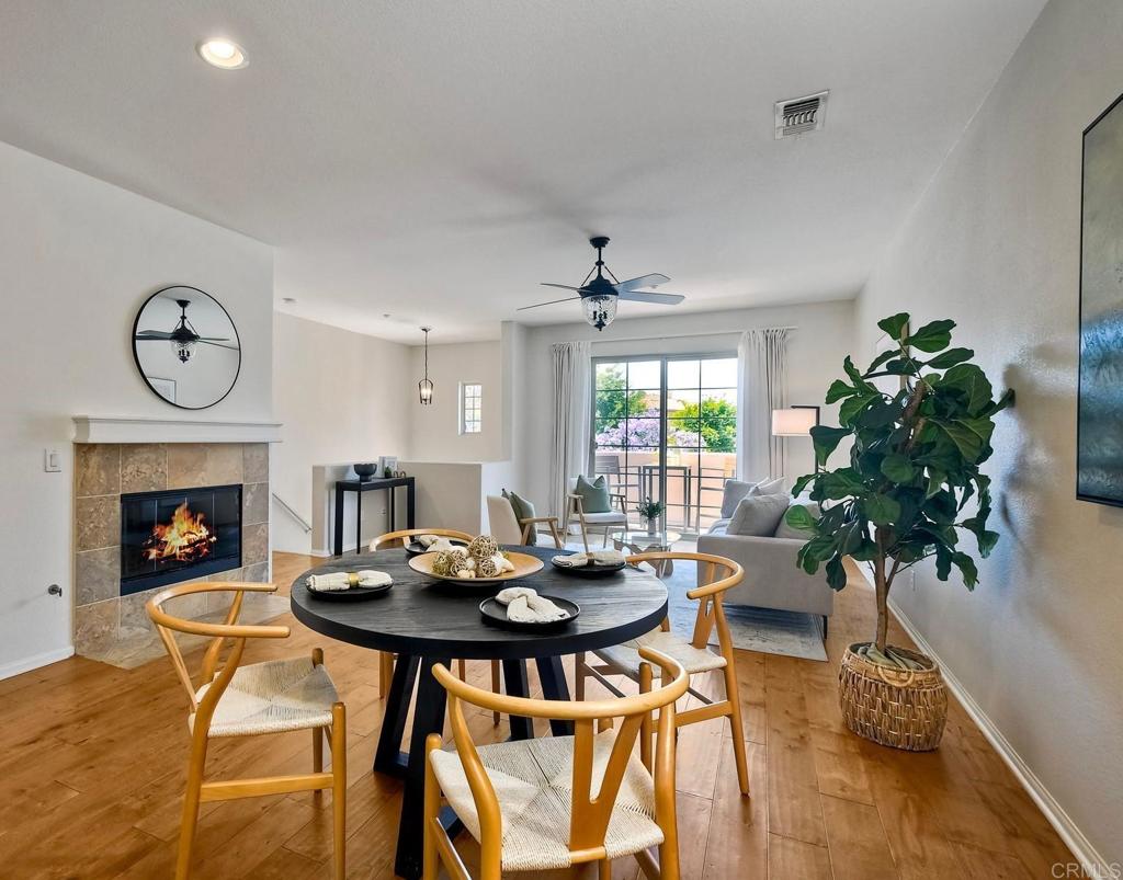 Welcome to your move-in ready dream home in the peaceful, tree-lined community of Larkspur Heights in San Marcos! This charming 2-bedroom, 2.5-bath townhome features an attached 2-car garage and a convenient entry-level bedroom with a full bath—perfect for guests or multi-generational living. Upstairs, enjoy a bright and open floor plan with a spacious family room and dining area centered around a cozy fireplace. The beautifully appointed kitchen boasts granite countertops, stainless steel appliances, ample cabinetry, and an island—ideal for entertaining or casual meals. Natural light floods the space through a sliding glass door, which opens to a charming Trex-deck balcony—your perfect spot for morning coffee or an evening glass of wine. Just off the kitchen, you’ll find a laundry area with a full-size, stackable washer and dryer, newly added in 2023. At the top of the stairs, a versatile mini-loft provides the ideal space for a home office or cozy retreat. The spacious primary suite features arched doorways, abundant natural light, a large walk-in closet, and an ensuite bath with dual sinks. Residents of Larkspur Heights enjoy access to a community pool and BBQ area just a short stroll from the home. All this, located in a highly desirable neighborhood known for its excellent schools and welcoming atmosphere.