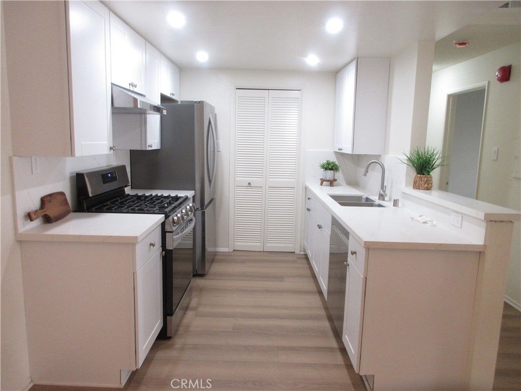Photo of 14607 Erwin St #210, Van Nuys, CA 91411 (MLS # SR26059780)