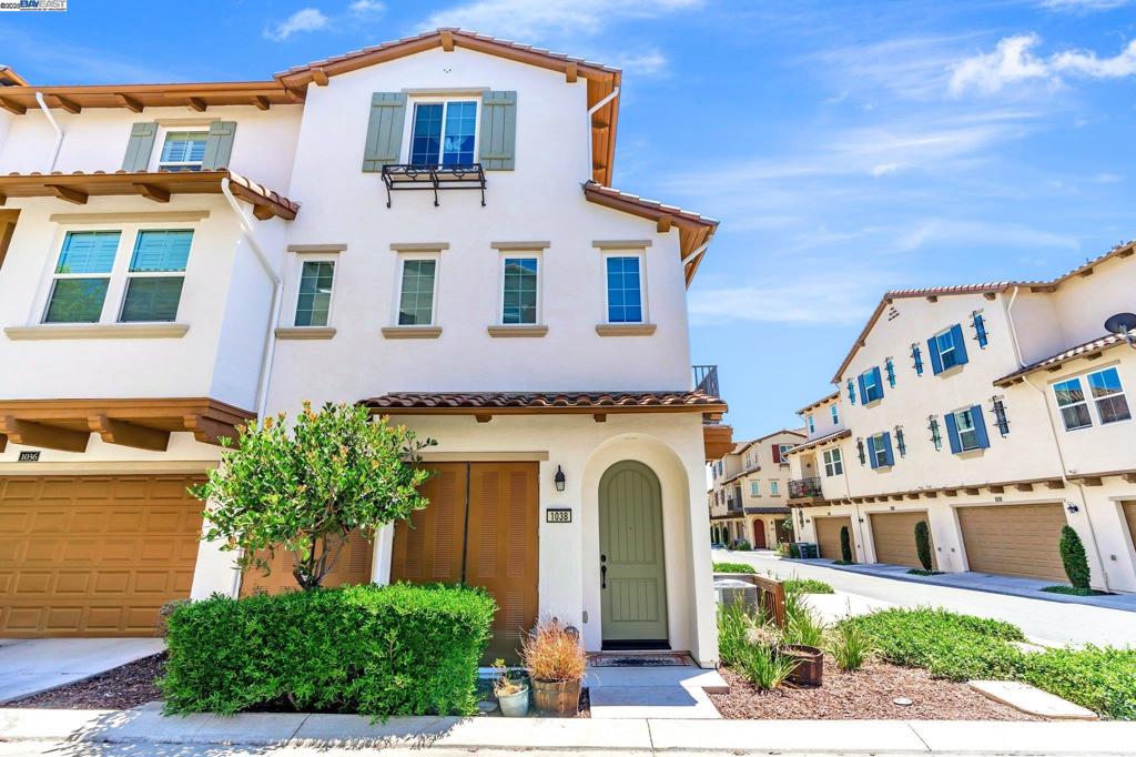 Exquisite end-unit townhouse-style condo in desirable Gale Ranch, perfectly located across from the brand-new Critter Crossroad Park! This light-filled home features an open-concept floor plan with hardwood floors, plush carpet, recessed lighting, and designer paint. The chef’s kitchen boasts quartz countertops, stainless steel appliances, upgraded cabinetry, and a large island ideal for entertaining. Enjoy seamless indoor-outdoor living with a spacious balcony off the second-floor living/dining area. A bedroom and full bath on the main level provide ideal guest accommodations. Upstairs, you'll find two generously sized en-suites. The primary suite offers vaulted ceilings, a custom walk-in closet, built in wall closet and spa-like bath with dual vanities and a sleek shower. Dedicated laundry closet with washer/dryer included. Close to top-rated San Ramon schools, parks, and shopping. Experience comfort, convenience, and community in one stunning package!