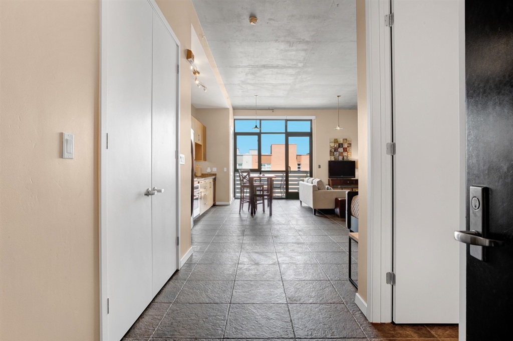 Enjoy trendy loft living at desirable M2i. This 6th floor furnished loft offers east views with views of the bay from the oversized balcony. Interior features include concrete walls and ceilings, tile floors, granite surfaces, stainless appliances, TV, linens, beech wood cabinets, down lighting, 11ft ceilings, in unit laundry, light & bright, spacious closets, neutral colors & central HVAC and parking. M2i amenities include gym, bike storage, court yard garden, BBQs & roof top sky lounge. Neighborhoods: East Village Complex Features: ,,,, View: City,Evening Lights Sewer: Sewer Connected